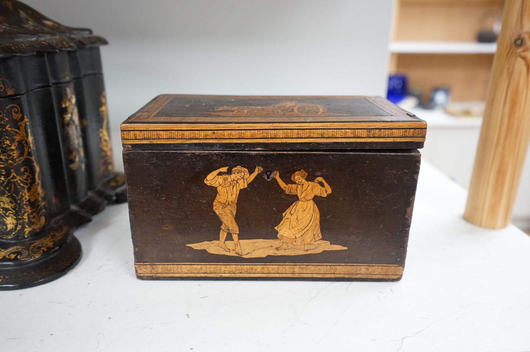 A large Victorian Papier maché and mother-of-pearl tea caddy, 32cm wide, and a Sorrento ware marquetry tea caddy, 19.5cm wide.